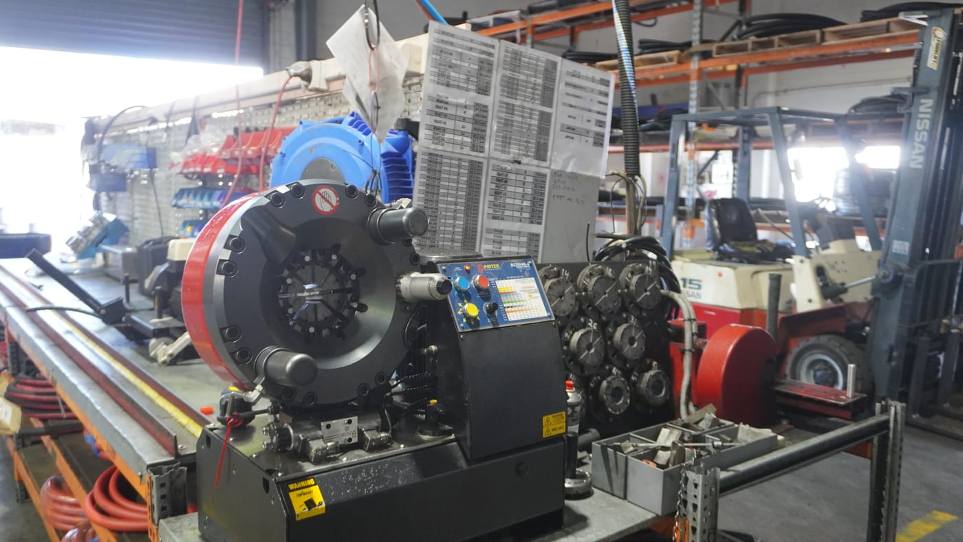 Pirtek Townsville workshop making up mine-spec hydraulic hose assemblies