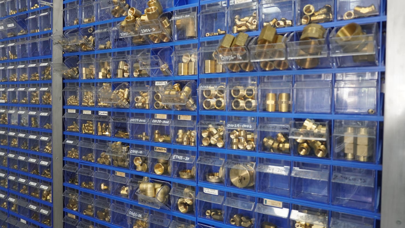 Pirtek Townsville's wall of hydraulic hose fittings — BSP, JIC, ORFS and metric in stock